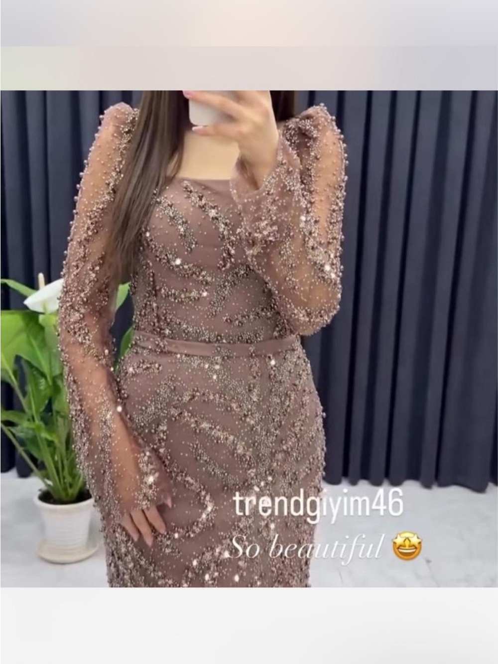 long sleeve taupe dress embellished with sequins and pearls.